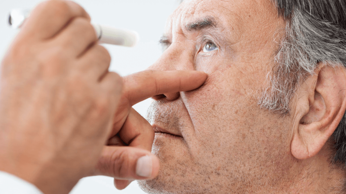 older man receiving eye exam